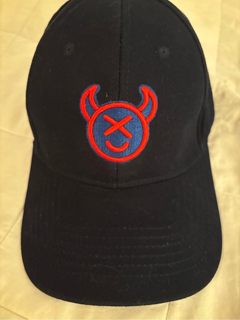 Source Unknown Black Cap with Red & Blue Devil Emblem
